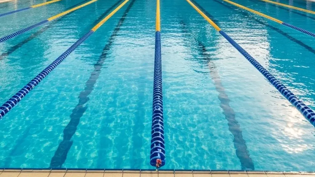 Lane ropes across an outdoor swimming pool